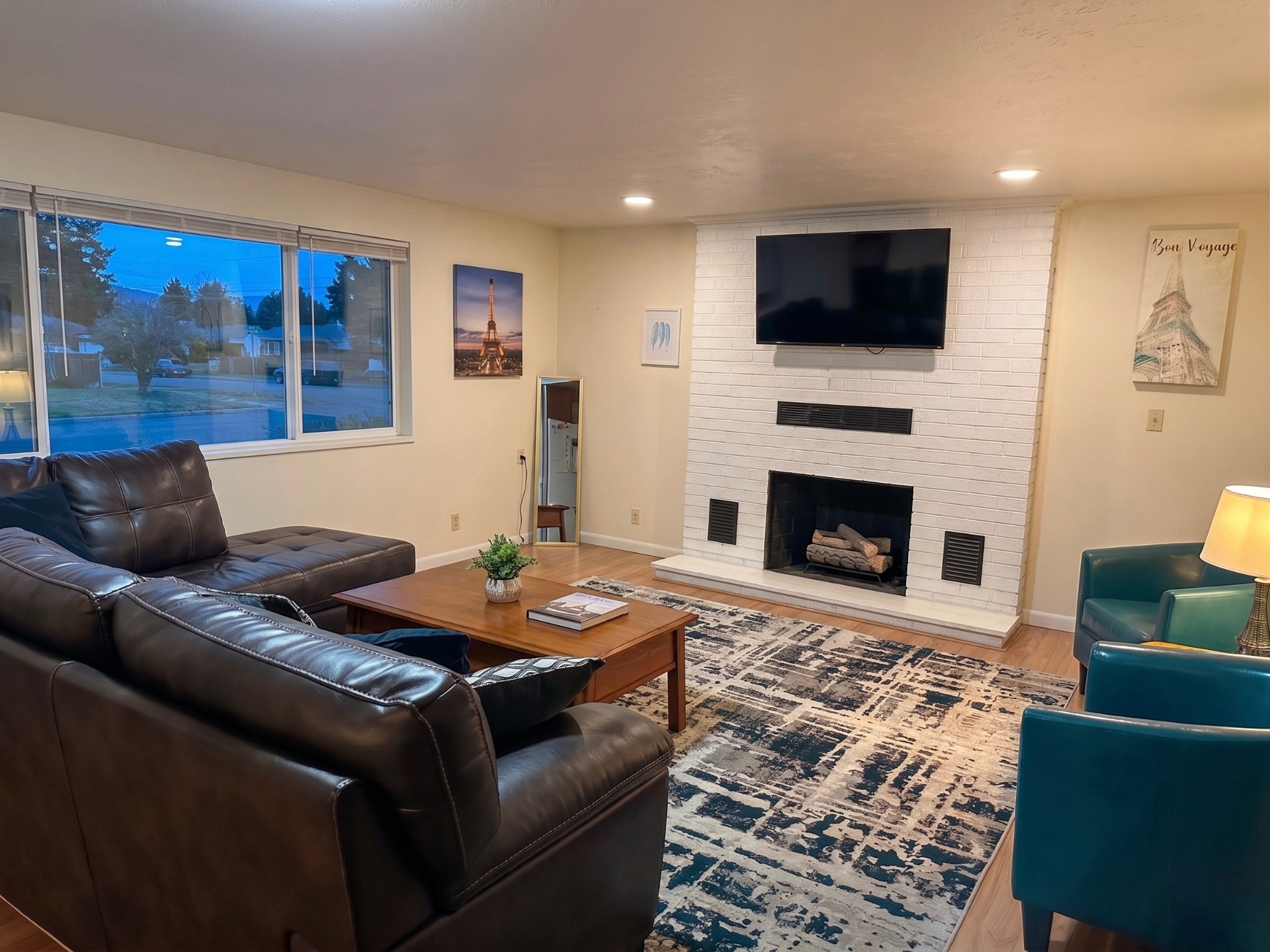 Rising Sun Pocatello living room with fireplace and leather seating