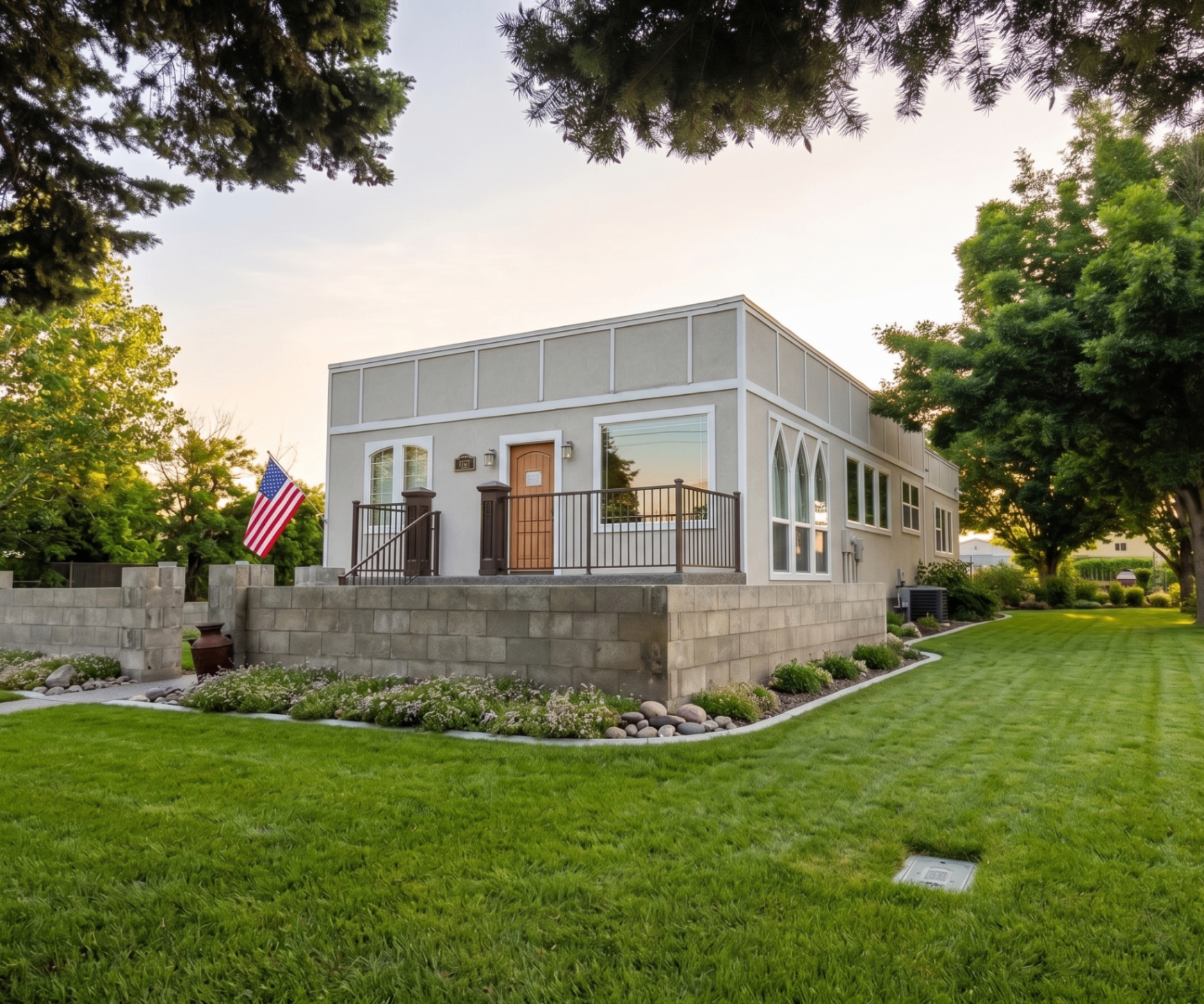 Rising Sun Lewiston stucco residence with landscaped lawn