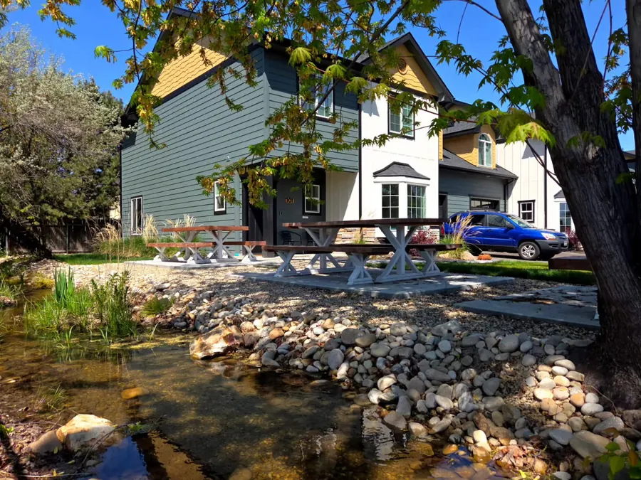 Rising Sun two-story residential home with covered porch and mature landscaping